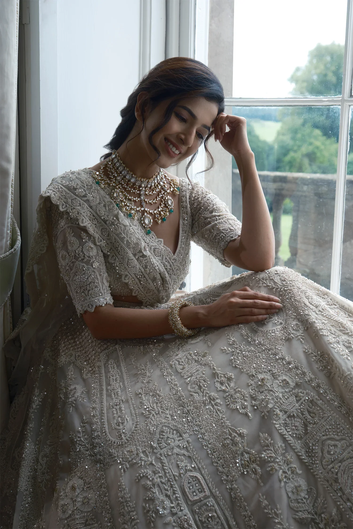 Off White Heavy Dori Embroidery Sequin Worked Lehenga in Net with Paisley and Floral Motifs - Image 3
